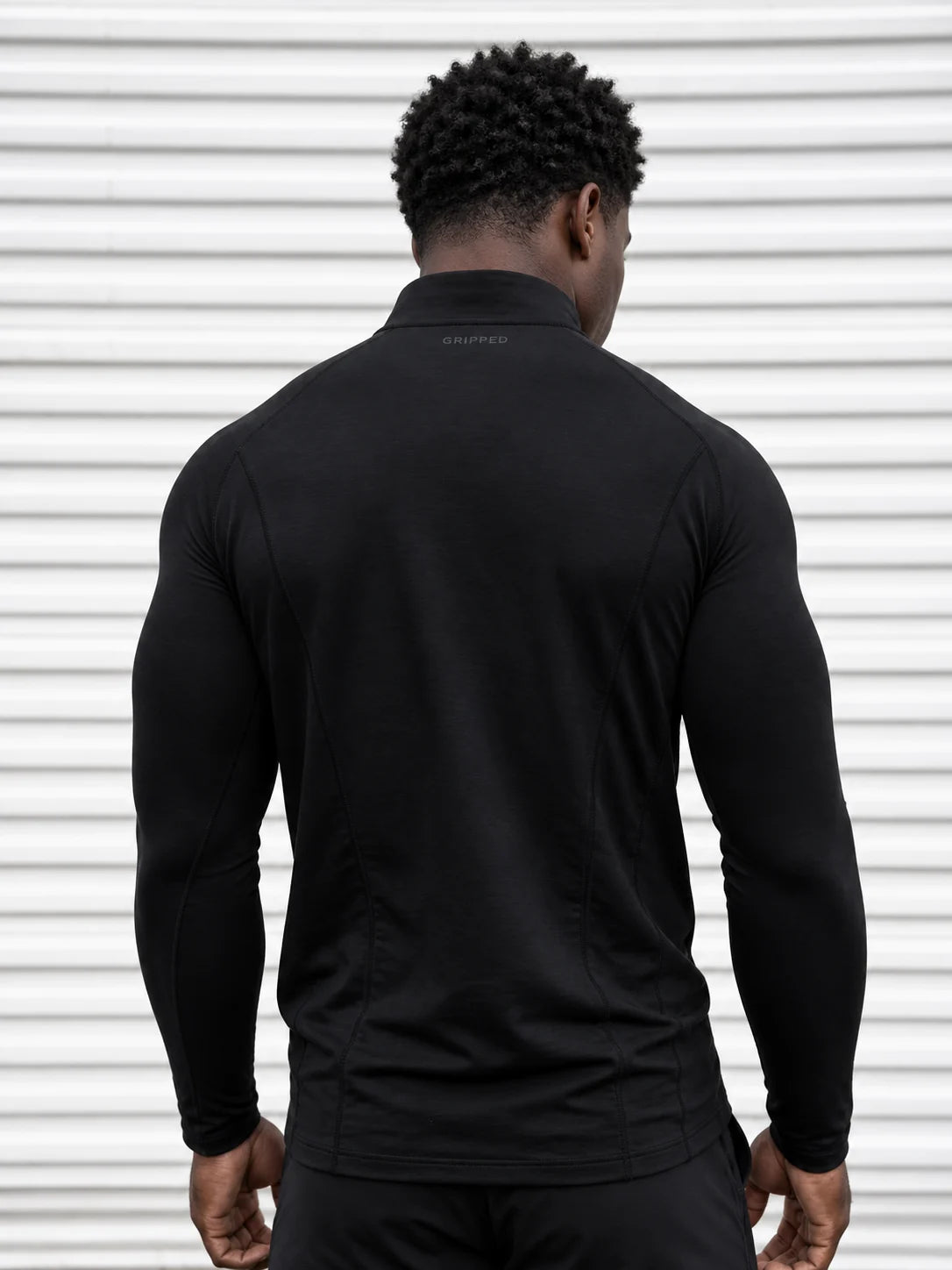 Black quarter zip — fitted back silhouette